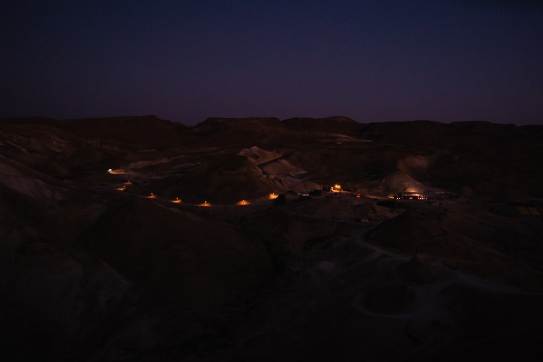 a night view of a mountain with lights on