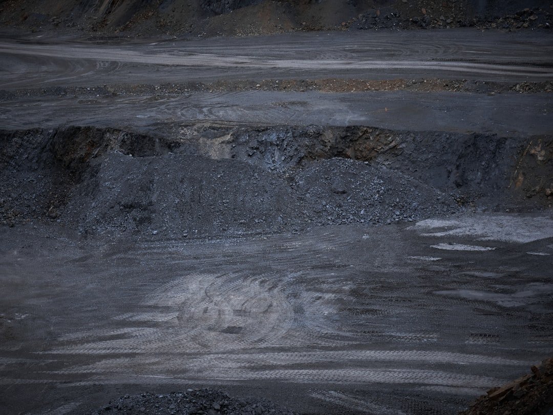 a black and white photo of dirt and rocks