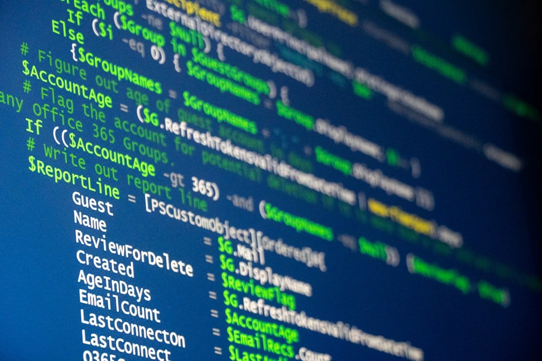 Computer code is displayed on a screen.