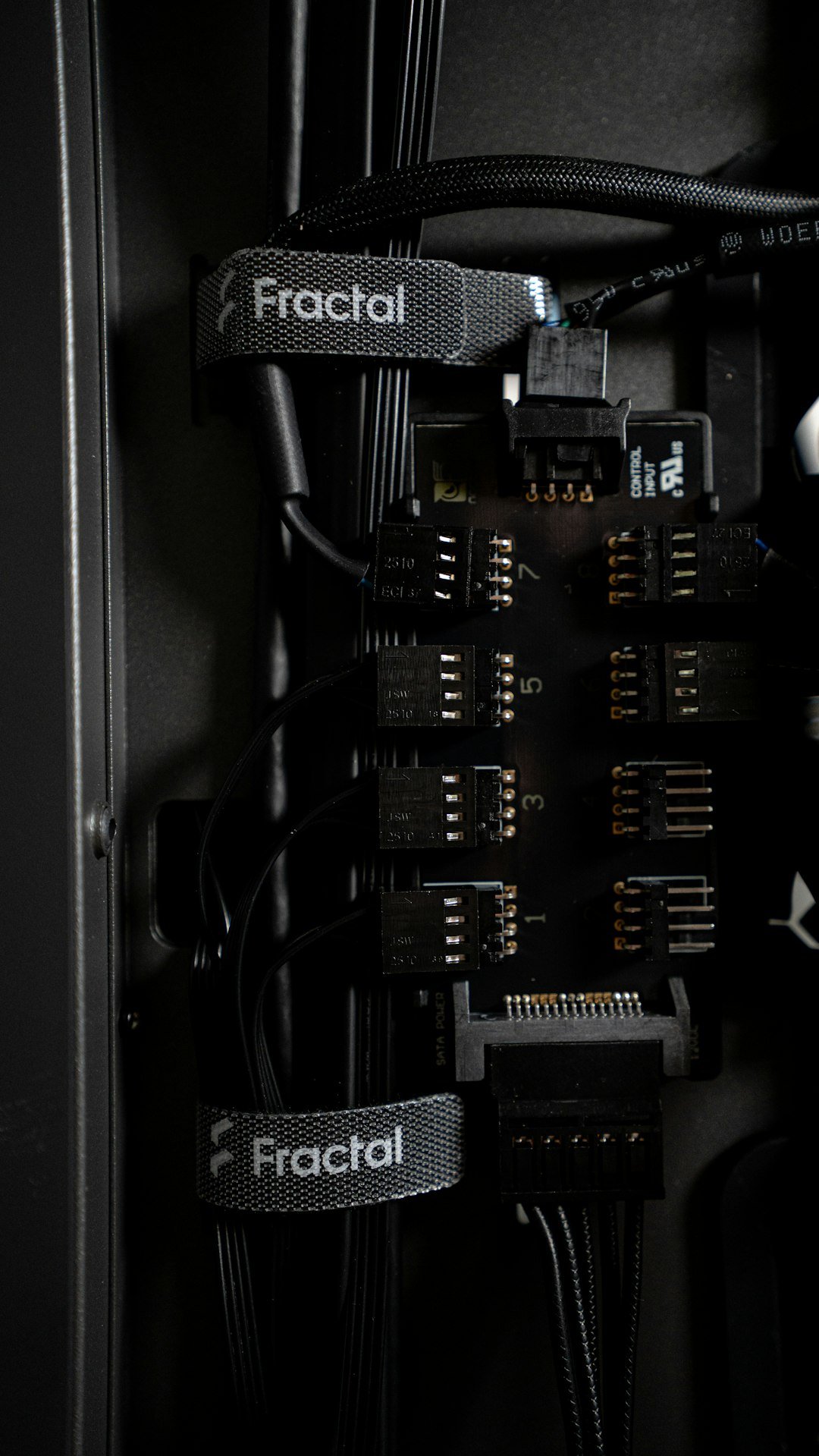 Internal PC components with many connectors.