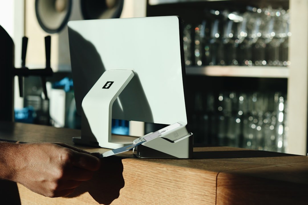 A person cutting a piece of paper with a knife