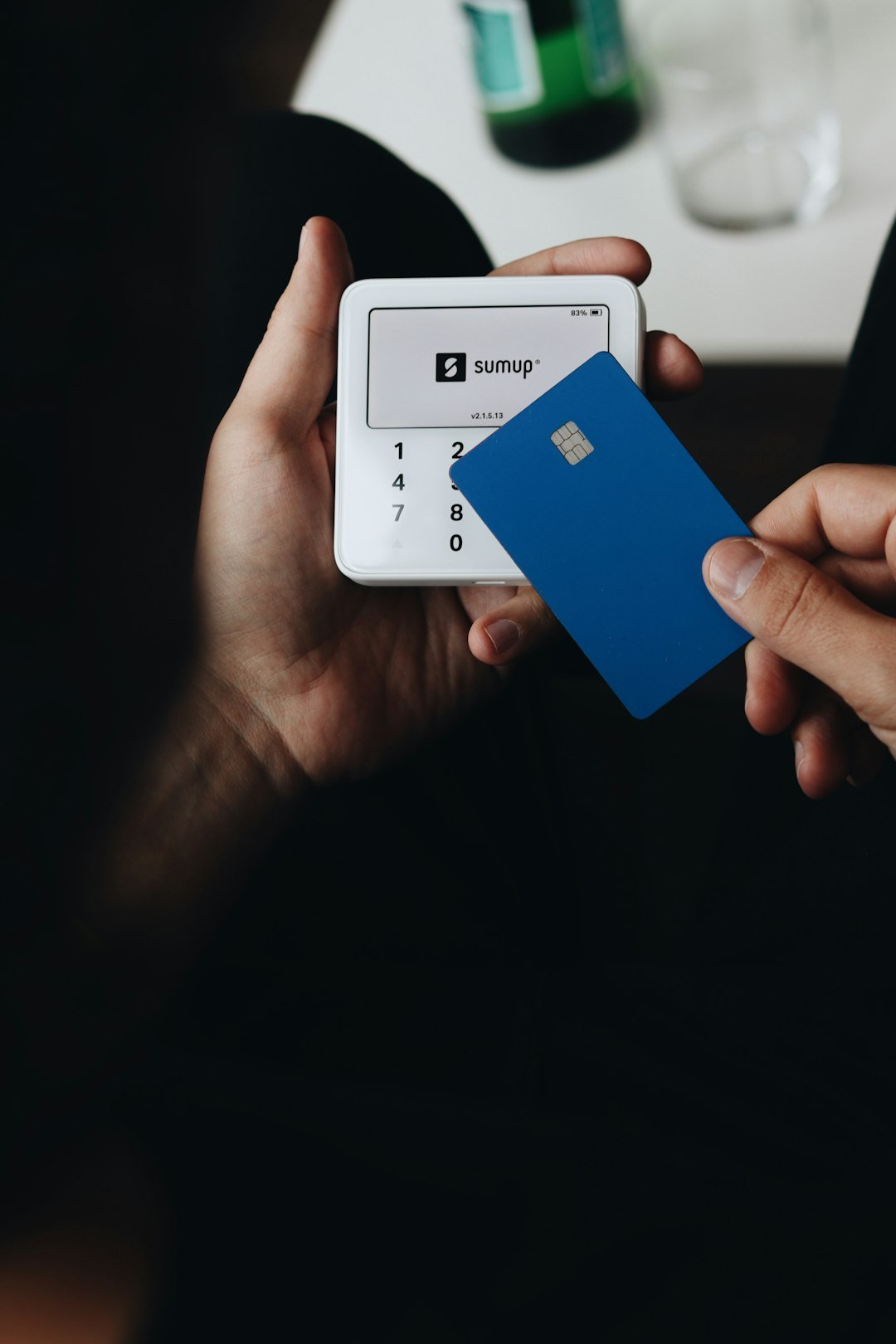 A person holding a credit card in their hand