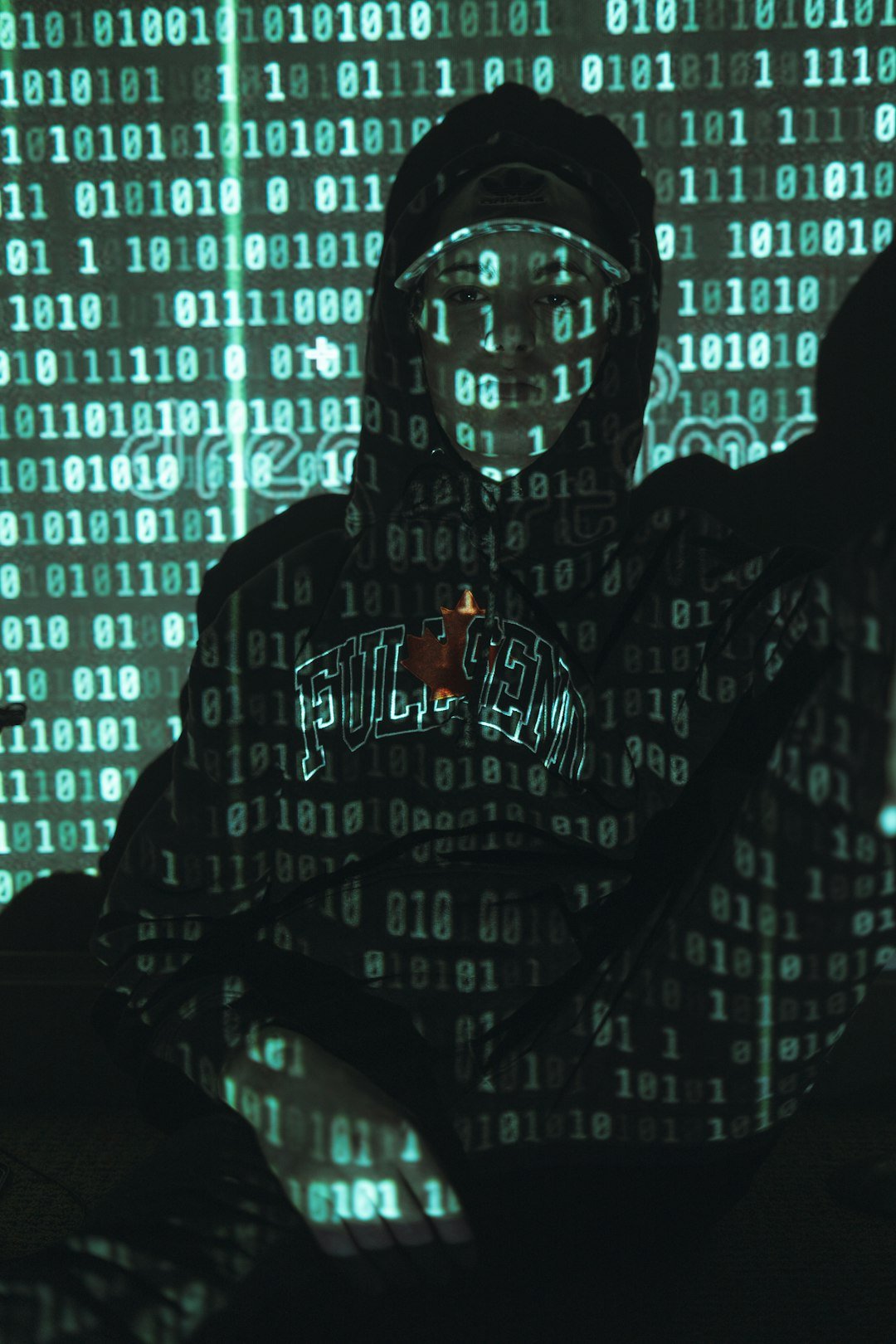 man in black hoodie standing