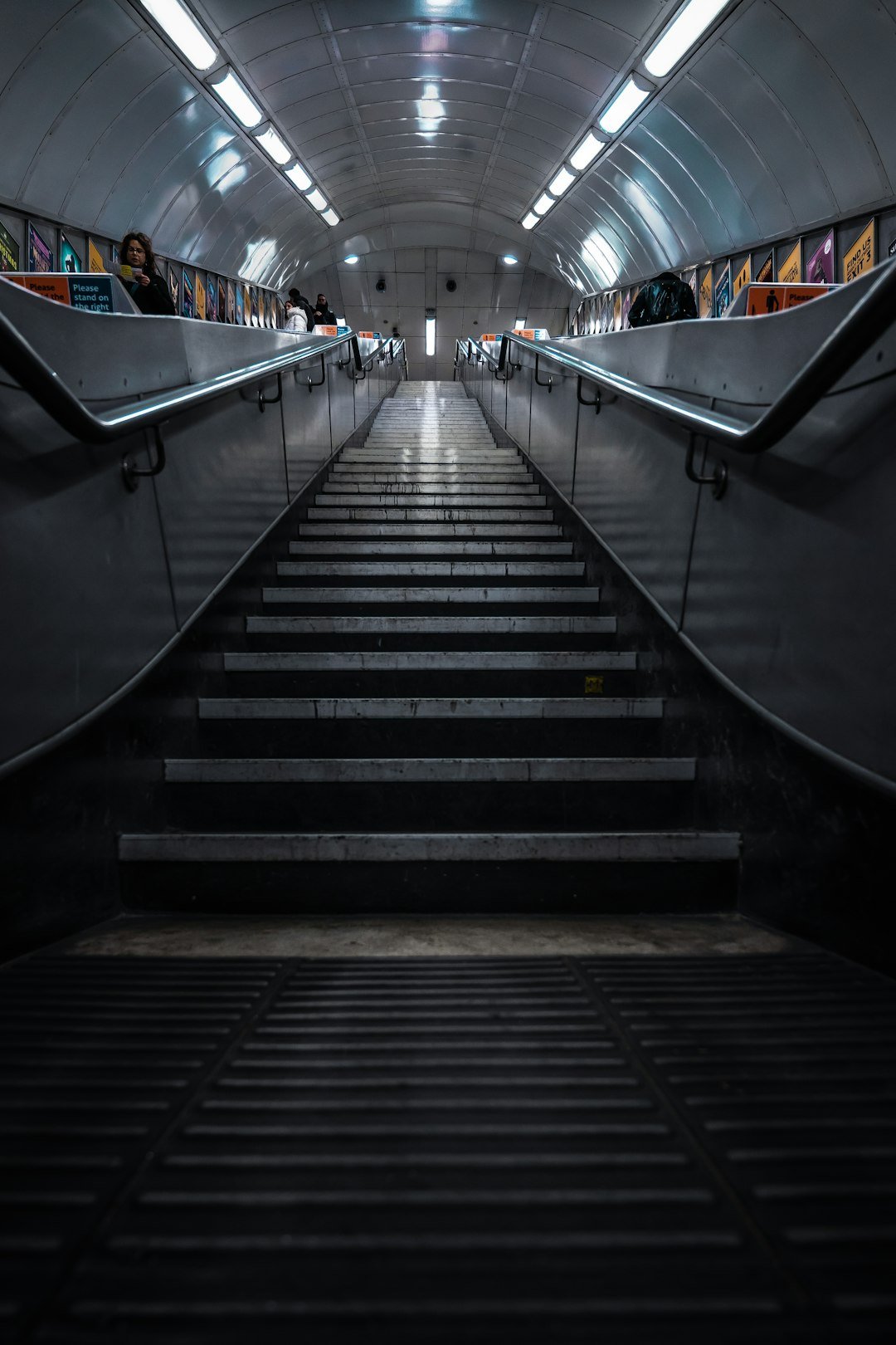 a set of stairs leading up to a subway station