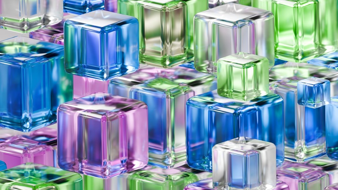Colorful, glossy cubes are stacked together in a pattern.