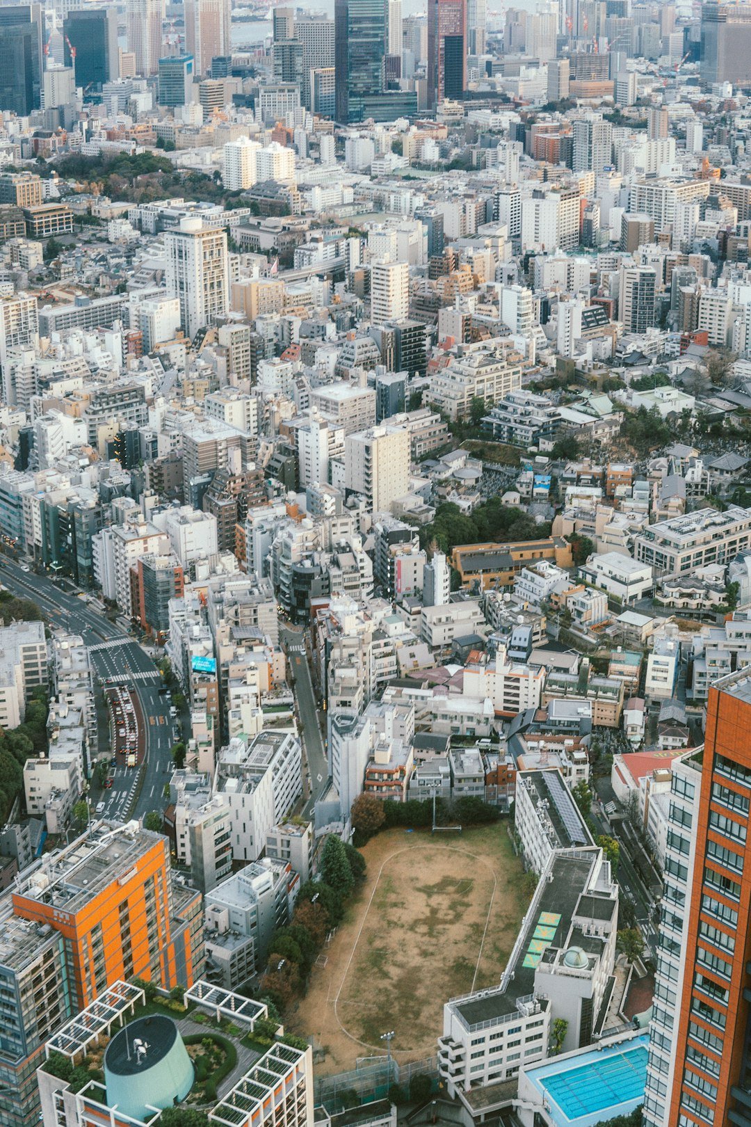 An aerial view of a city with tall buildings