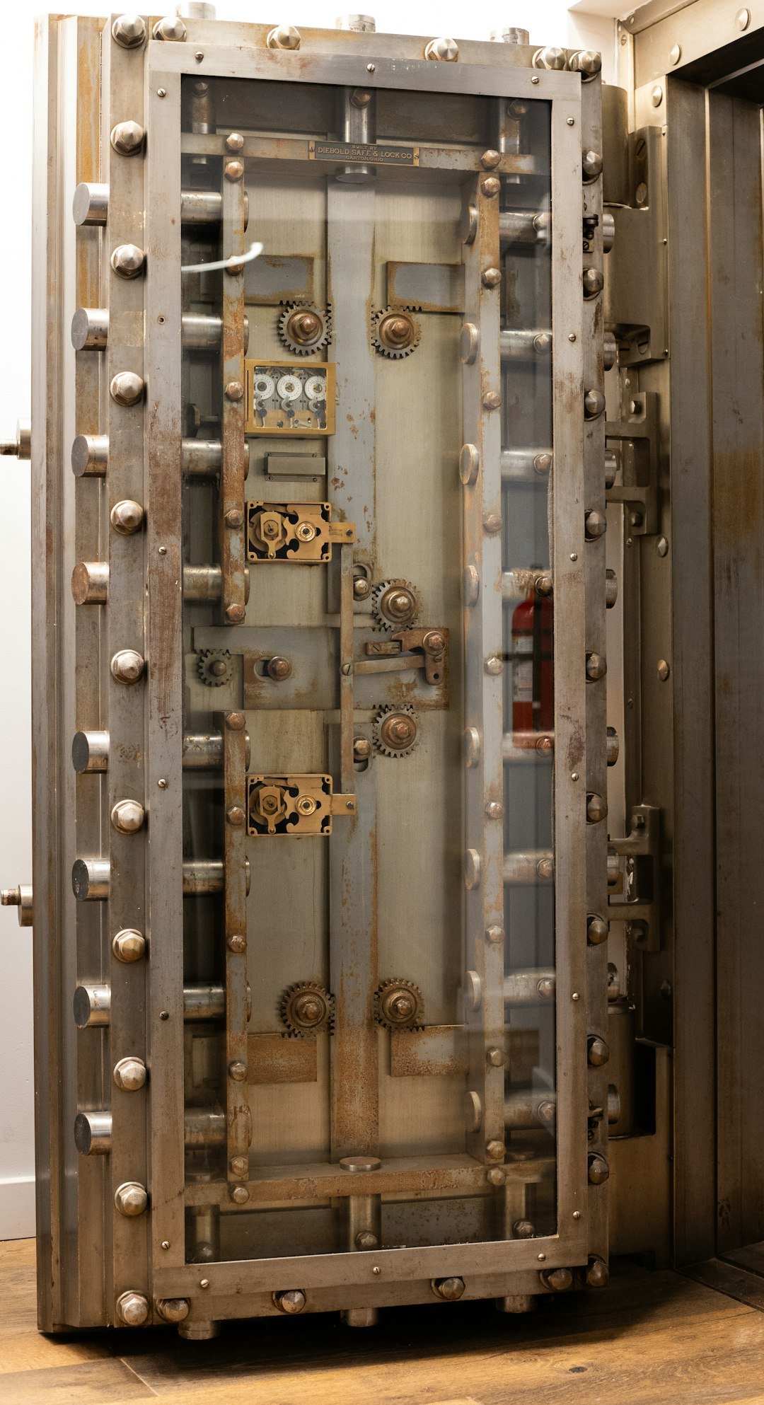 A metal door with a bunch of knobs on it