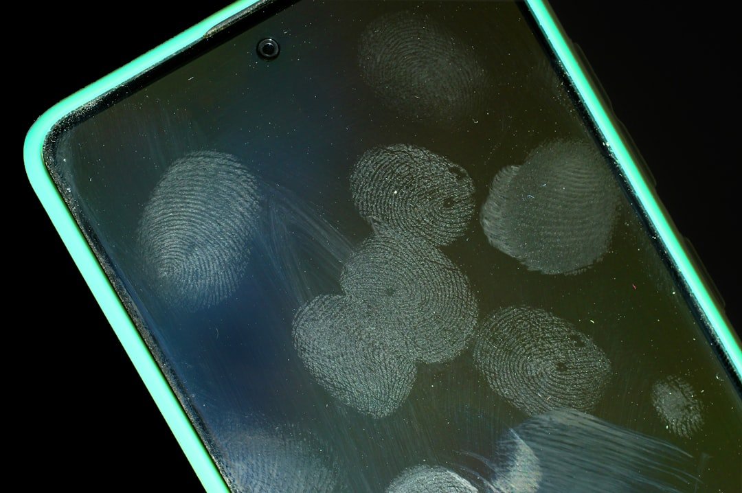 Smudged smartphone screen with fingerprints