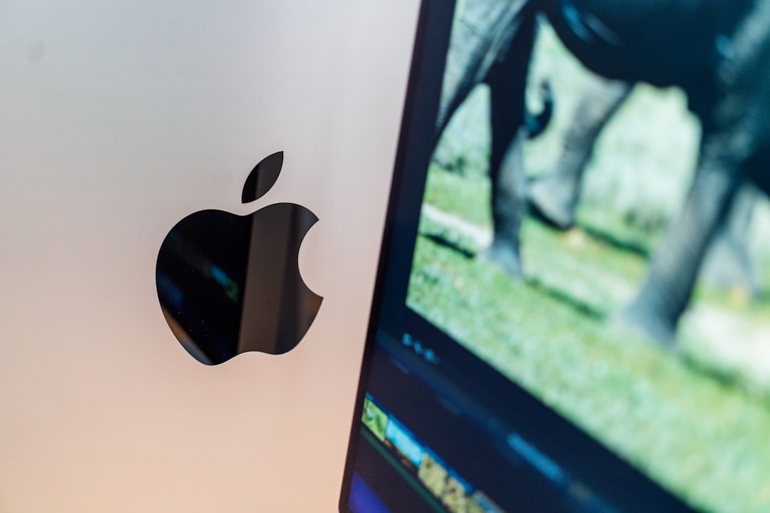 a close up of a computer screen with an apple logo on it
