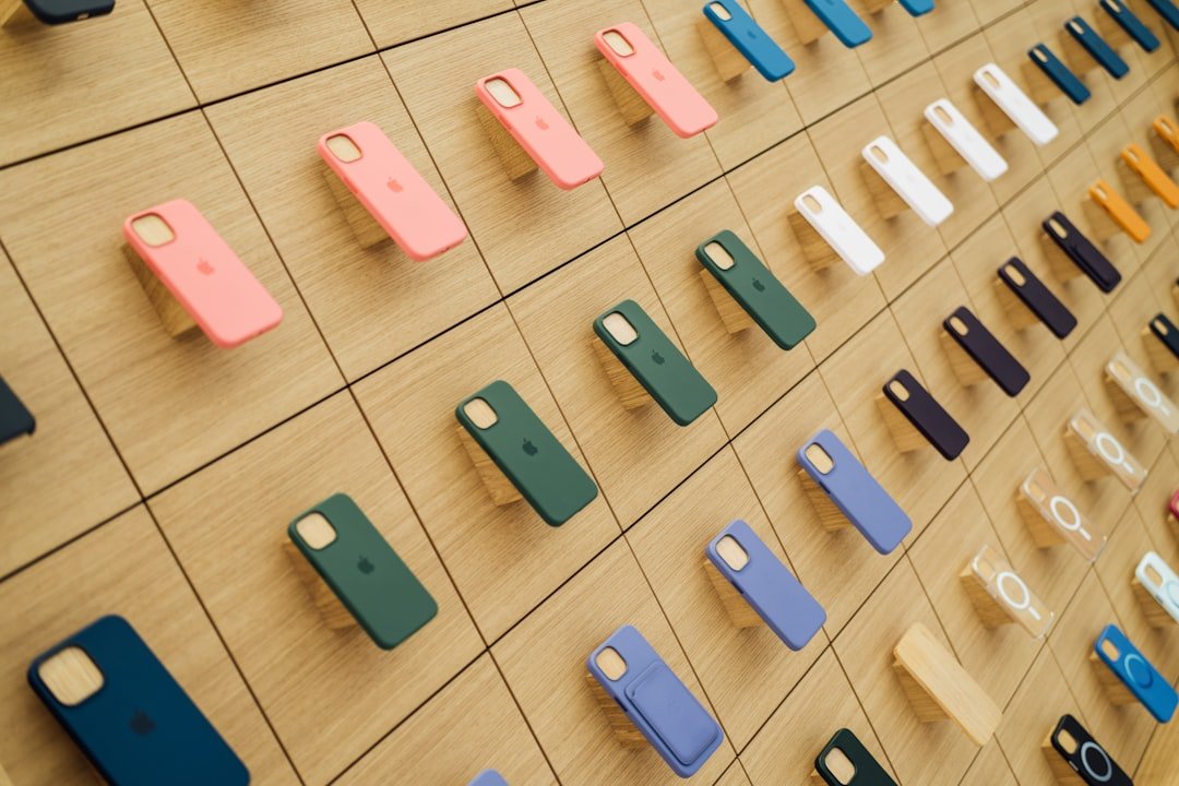 a wall with a bunch of cell phones on it