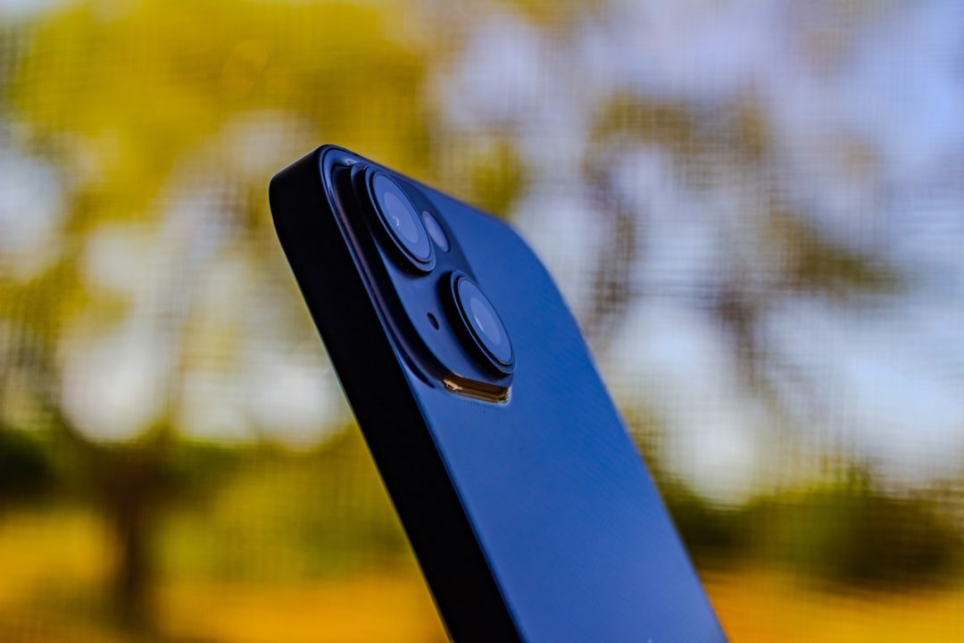 Close-up of a smartphone camera module outdoors