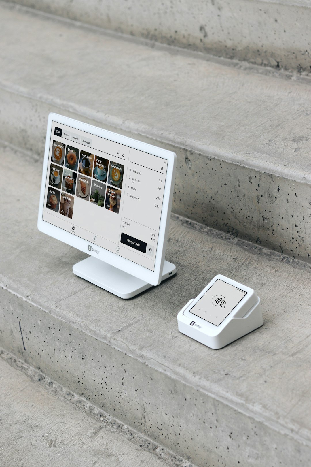 A computer monitor sitting on top of a set of stairs