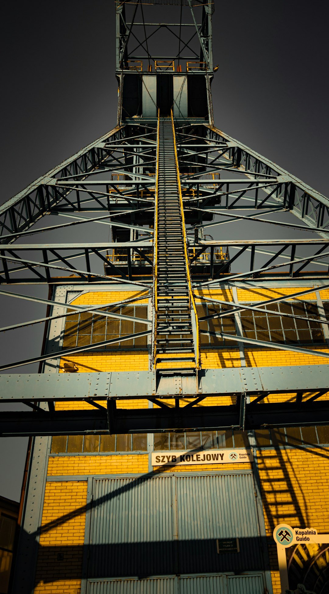 A tall metal structure with a sky background