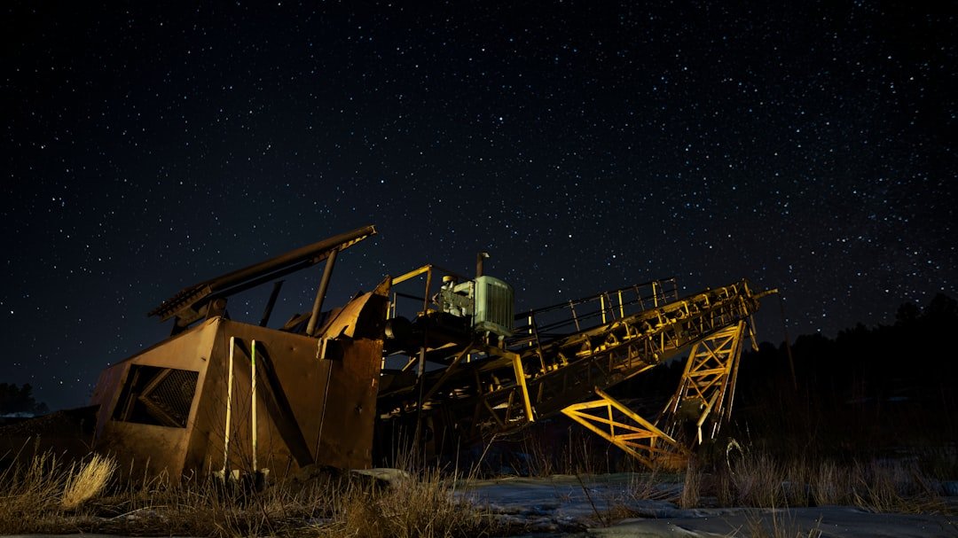 brown and black metal crane under starry night