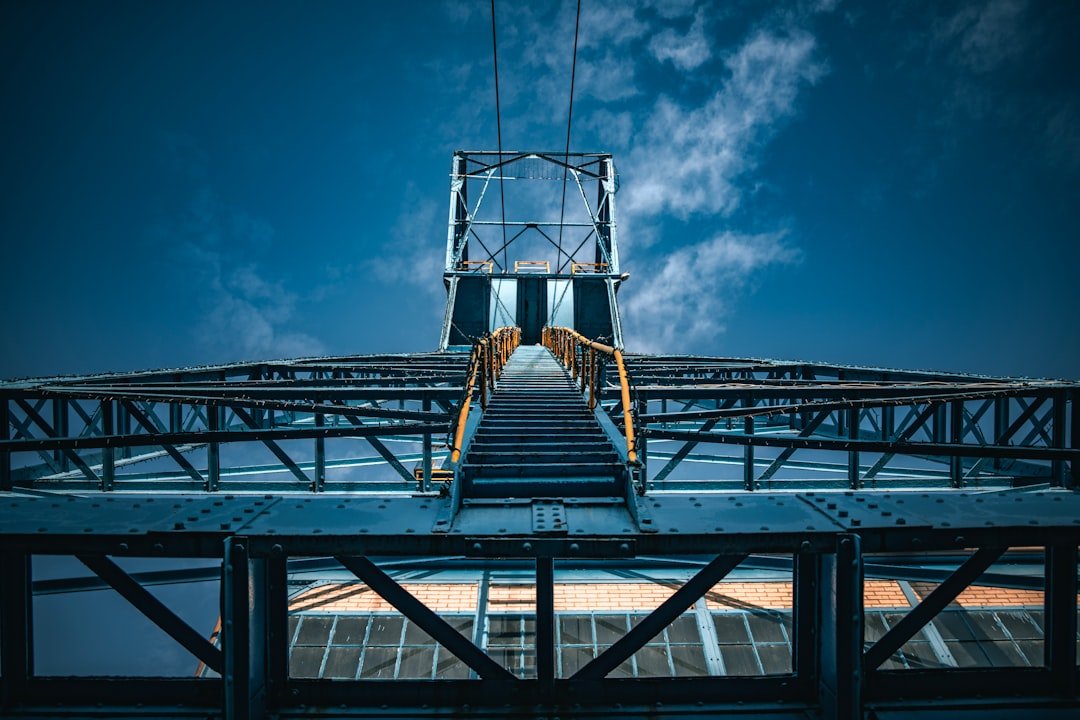 A very tall metal structure with a sky background