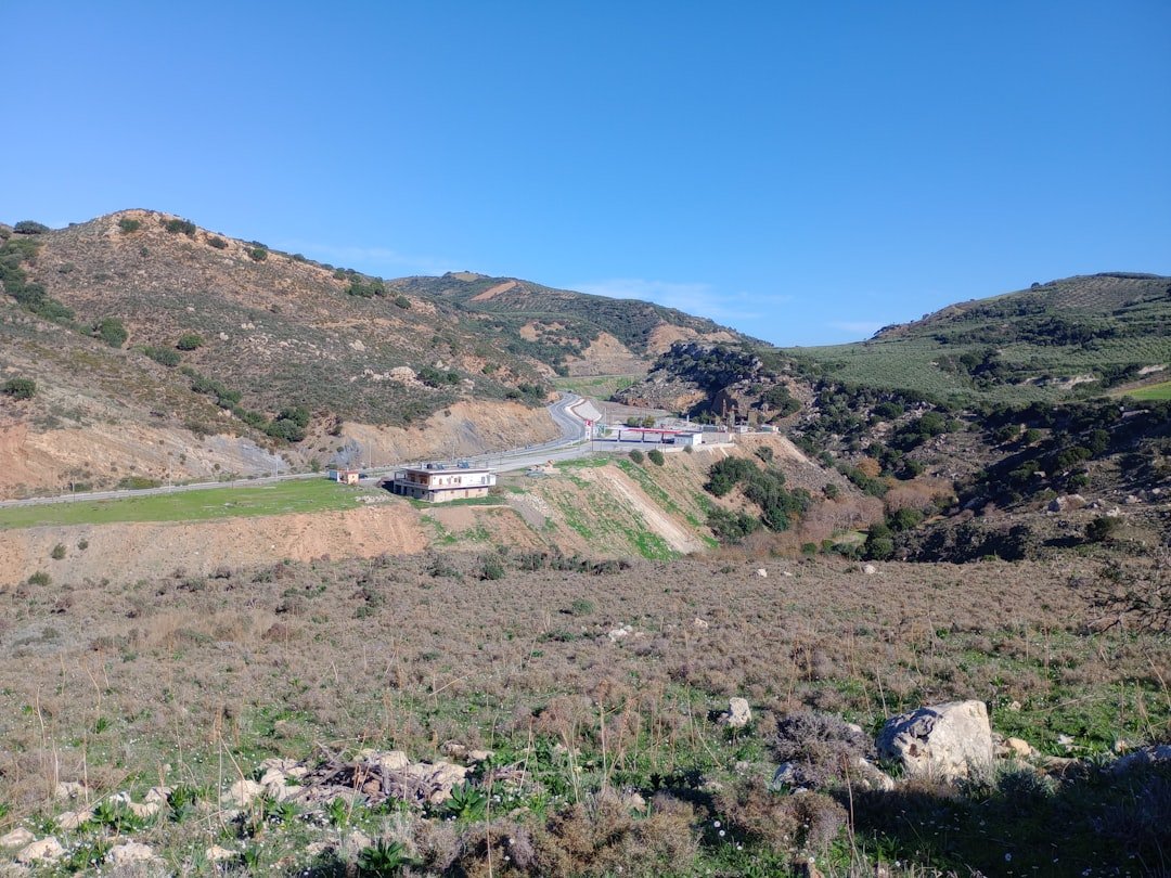 a scenic view of a road in the mountains