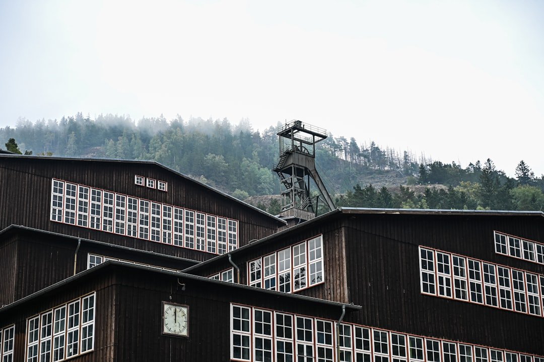 Old industrial buildings with a mine shaft tower.