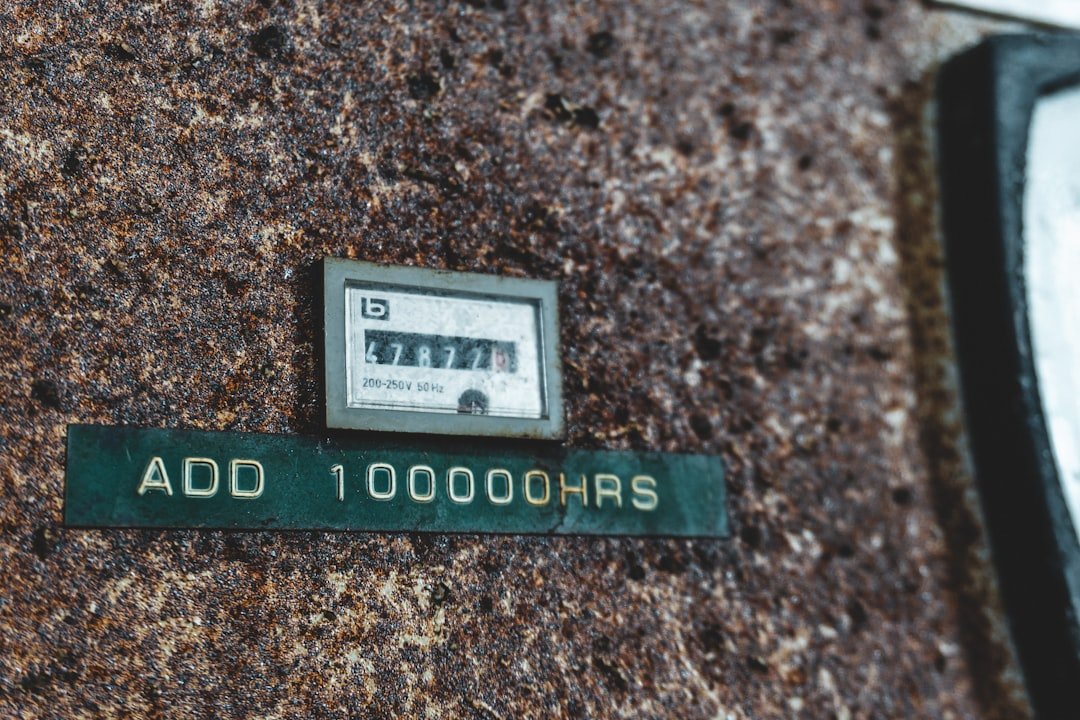 a close up of a street sign on the side of a building