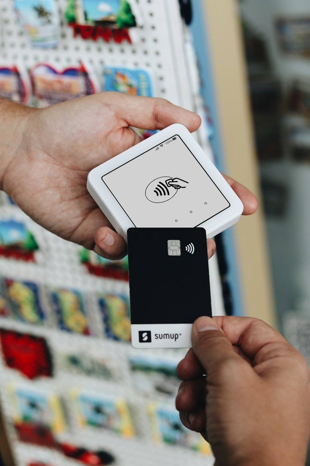 A person holding a smart phone in their hand