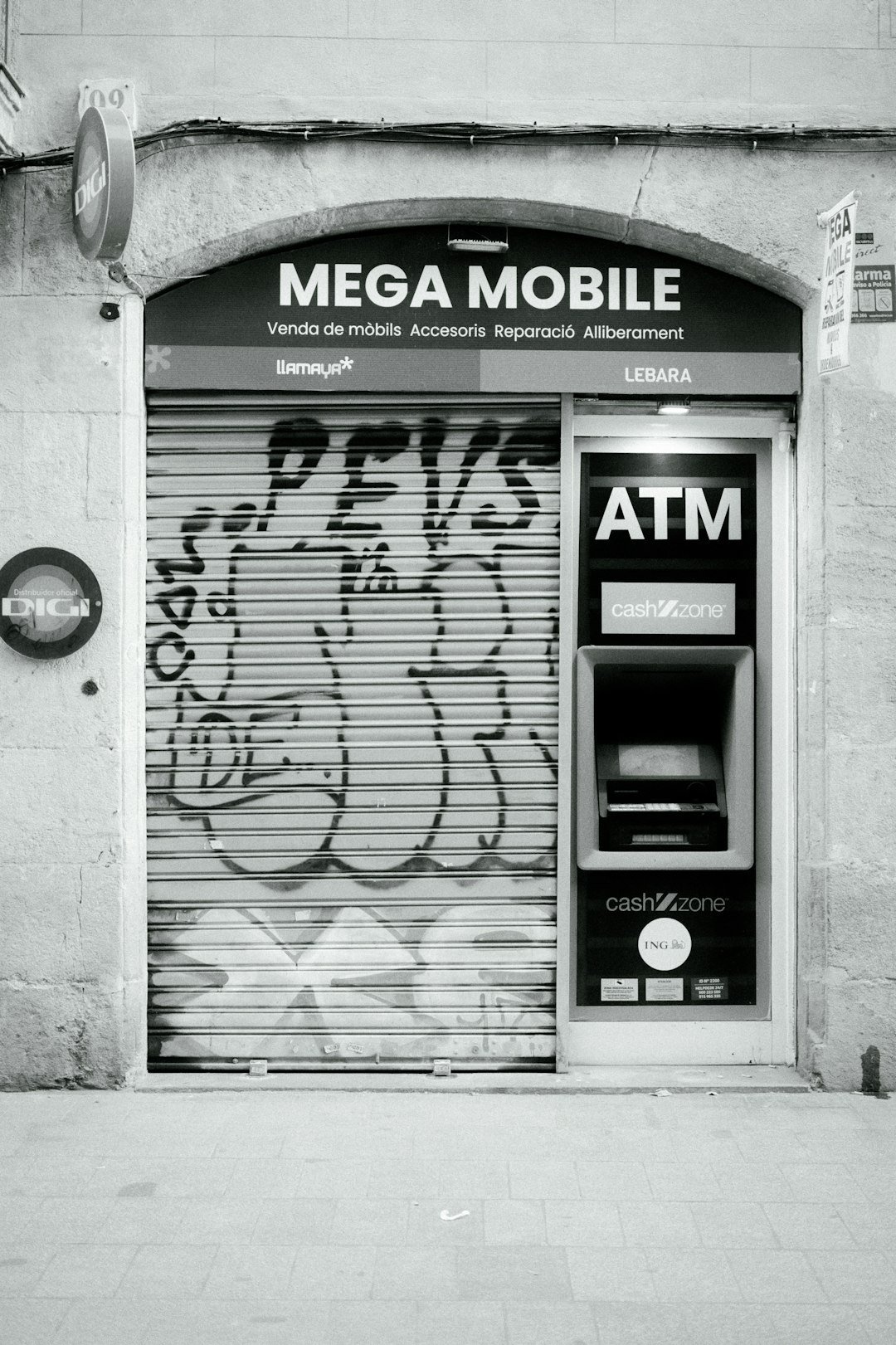 a black and white photo of a atm