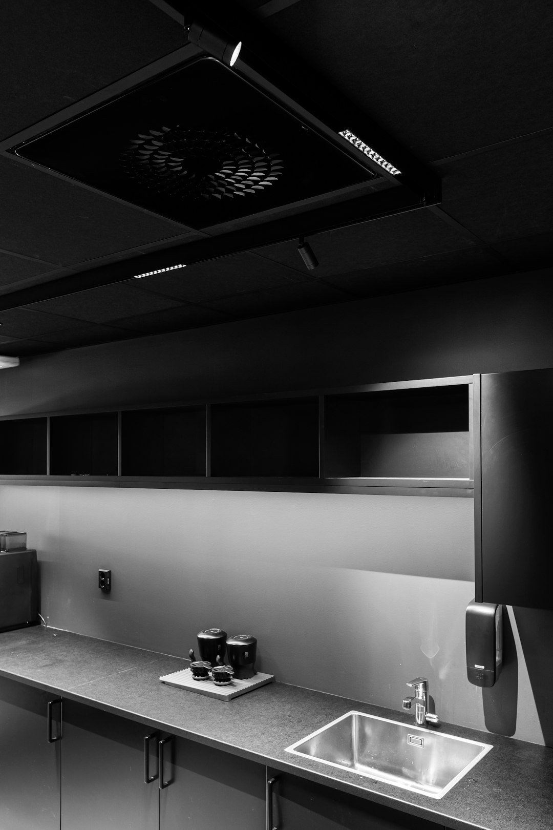 A black and white photo of a kitchen