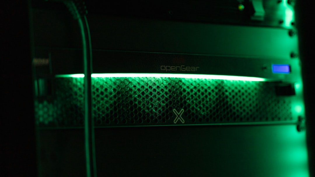 a close up of a green light in a server