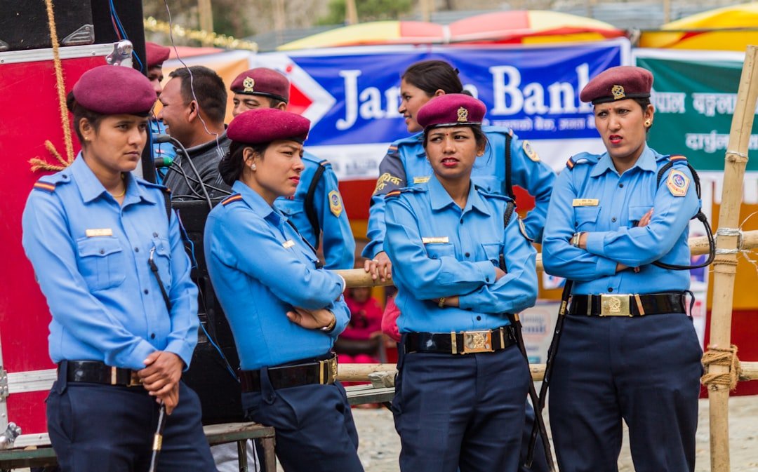 Group of female police officers standing with arms crossed