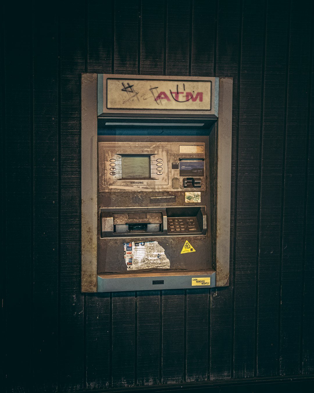 an old fashioned pay phone on the side of a building