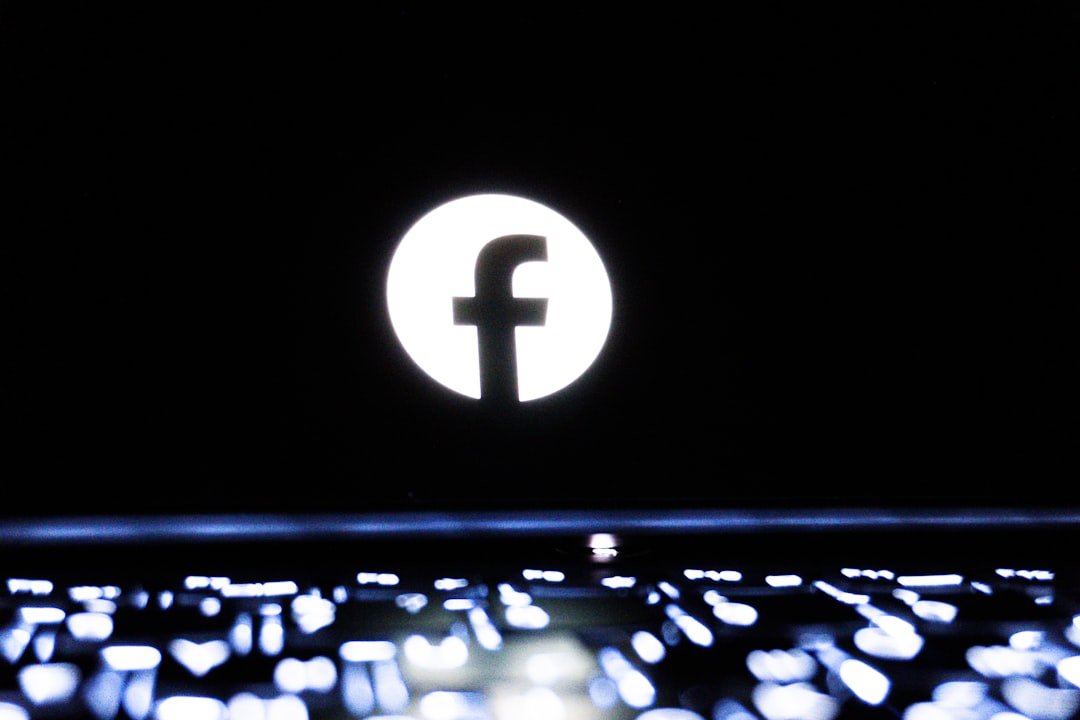 Facebook logo displayed on a dark background.